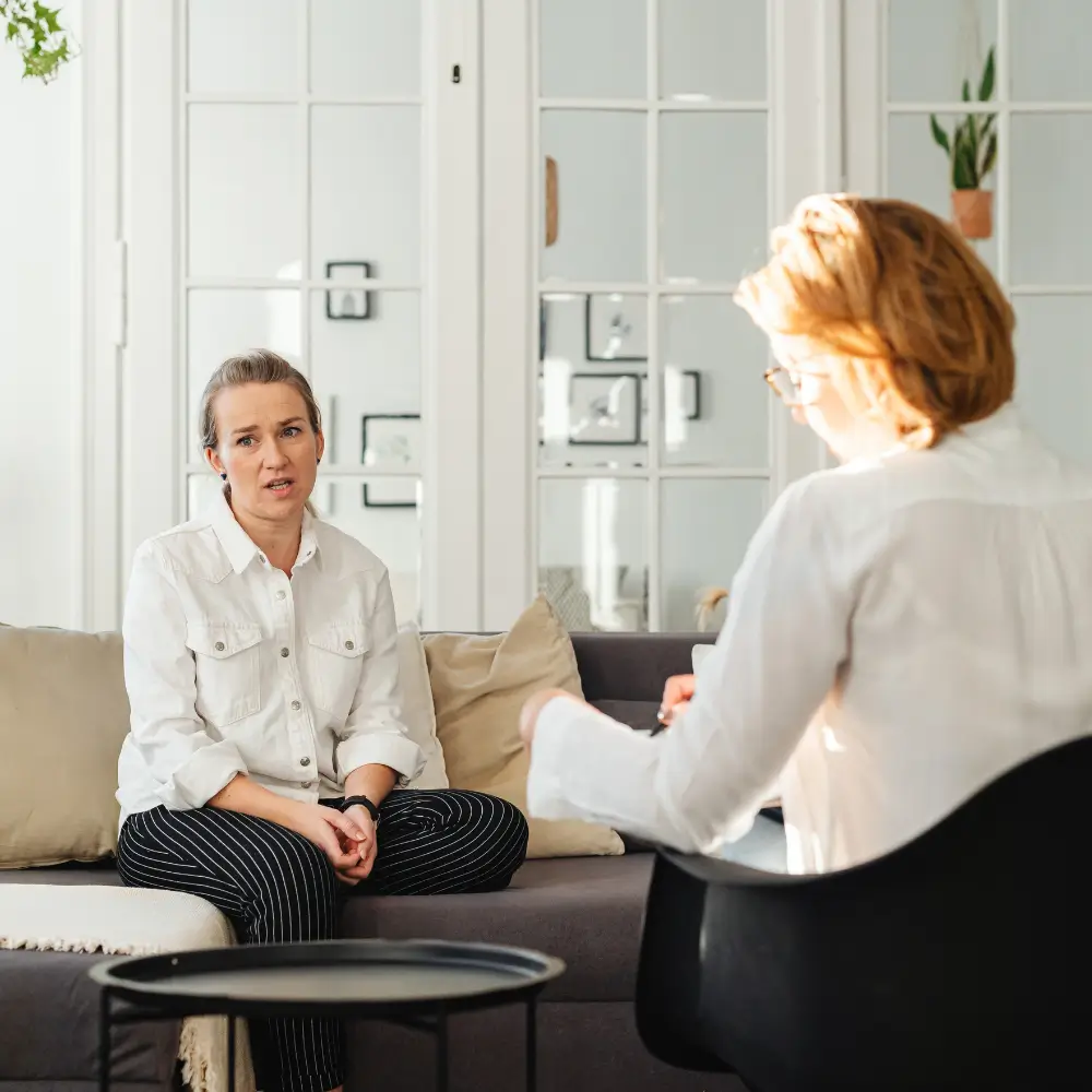 04 Counsellor and client talking in a private therapy room