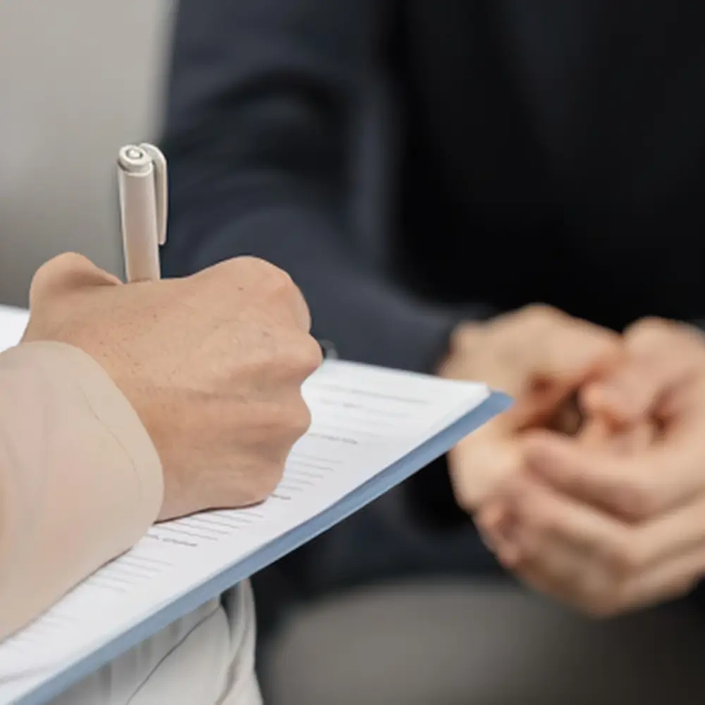 05 Close-up of therapist writing notes during counselling
